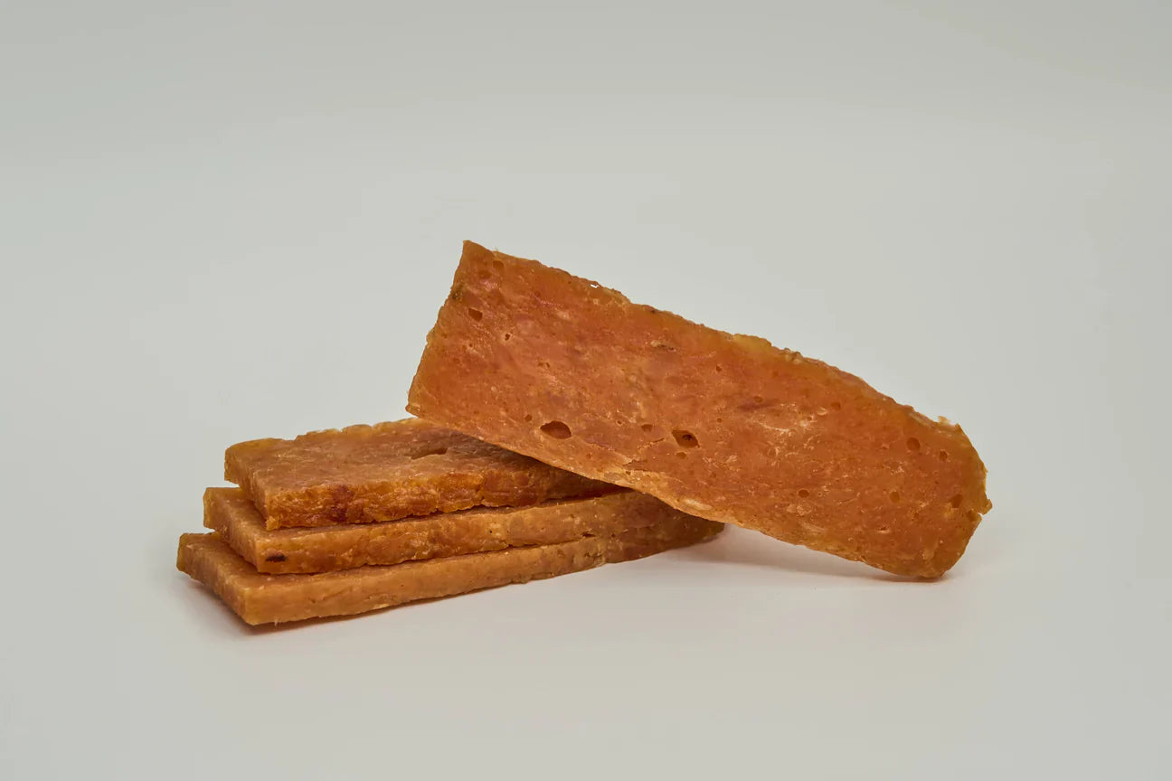 The Family Pet Chicken Dog Treats in a Stack, Perfect for Rewarding Your Furry Friend