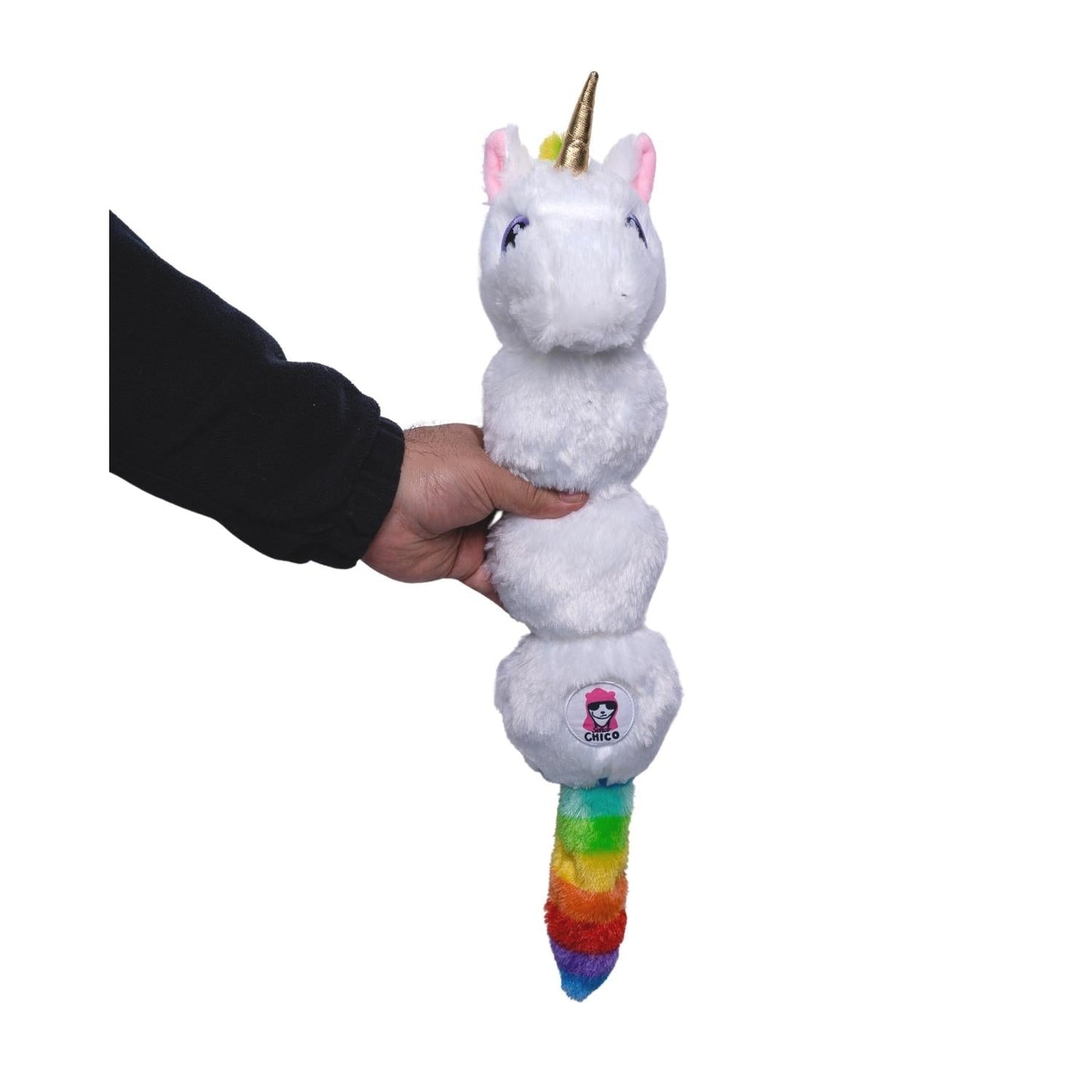 American Pet Supplies unicorn dog toy with squeaker plush chew toy held in hand with rainbow tail