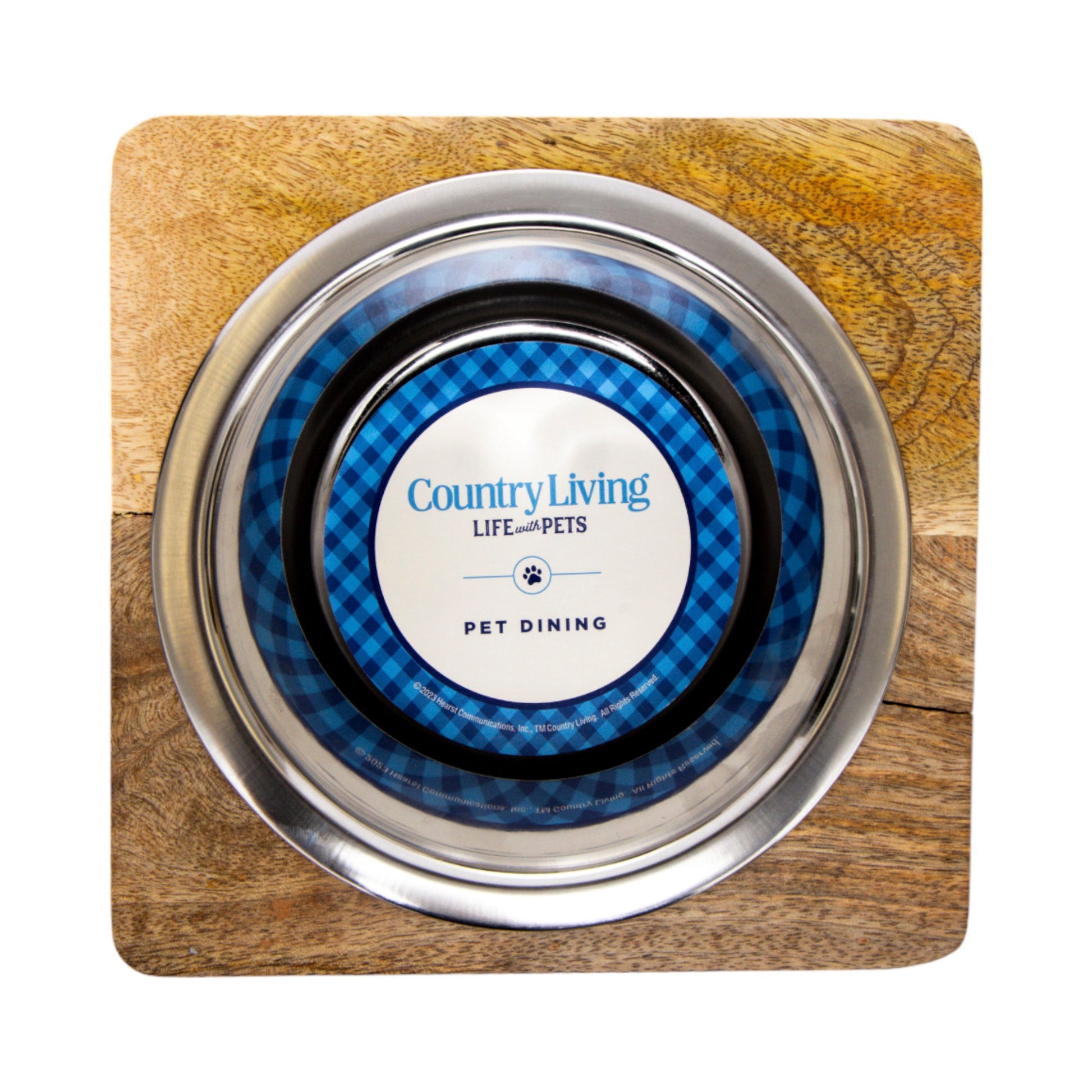 Stainless steel dog bowl with wood holder featuring a blue Country Living pet dining design