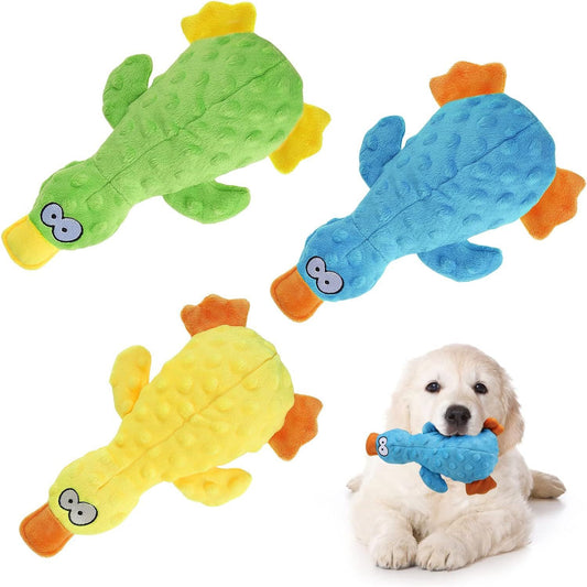 Colorful duck shaped dog toy in green blue and yellow with a dog holding the blue toy