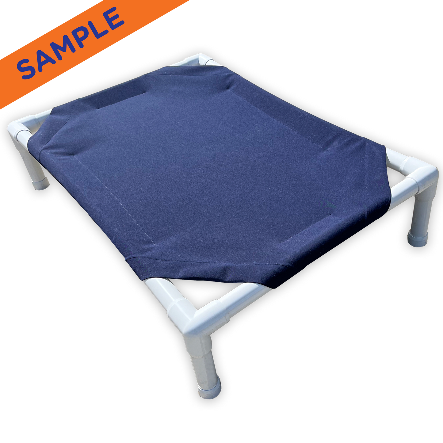 The Family Pet elevated pet bed with blue fabric and white PVC frame for comfortable outdoor use