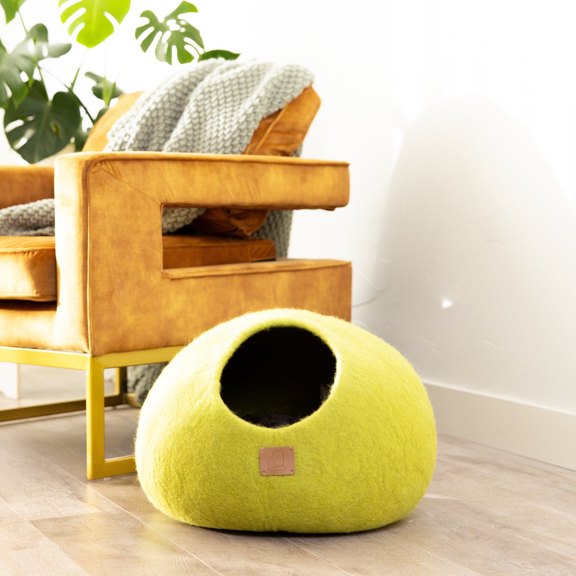 Cozy green cat cave bed made from soft material, ideal for lounging cats