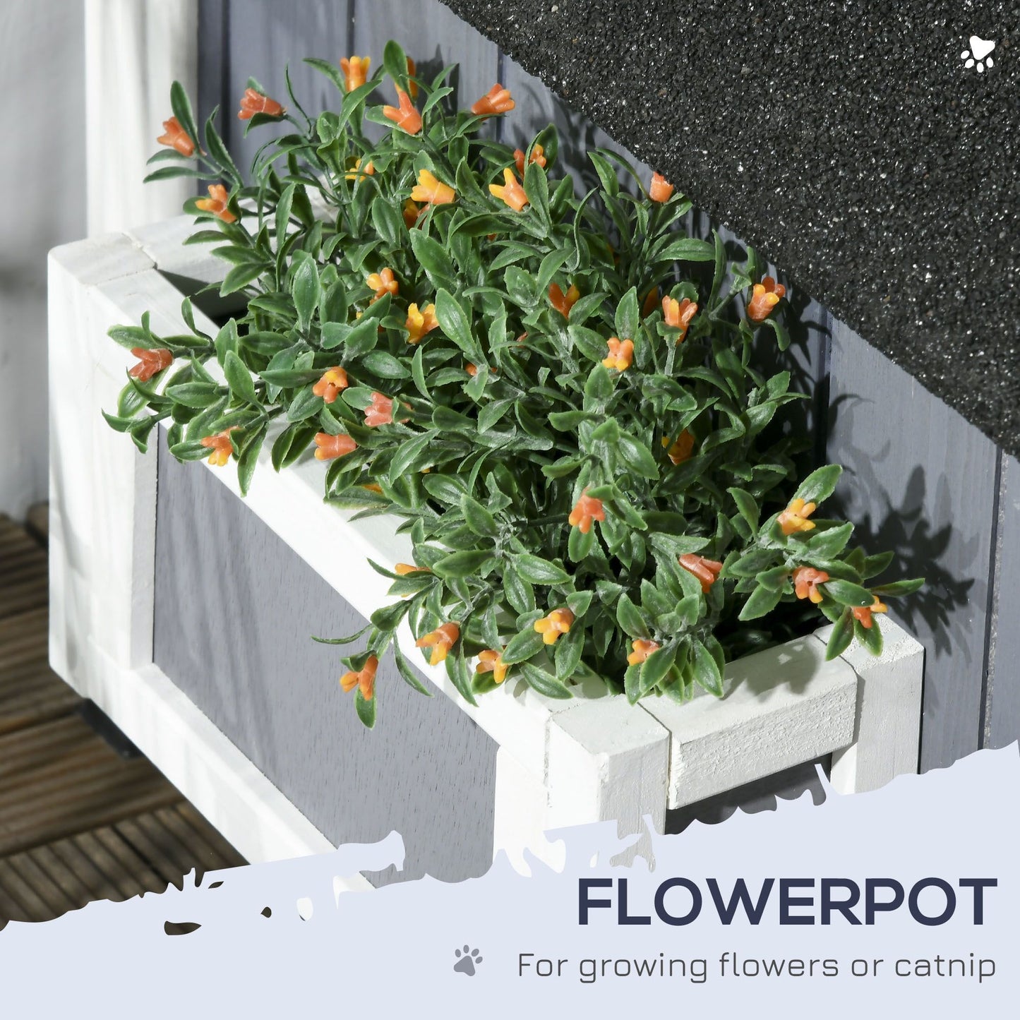 White outdoor cat house with flower pot featuring green leaves and small orange flowers