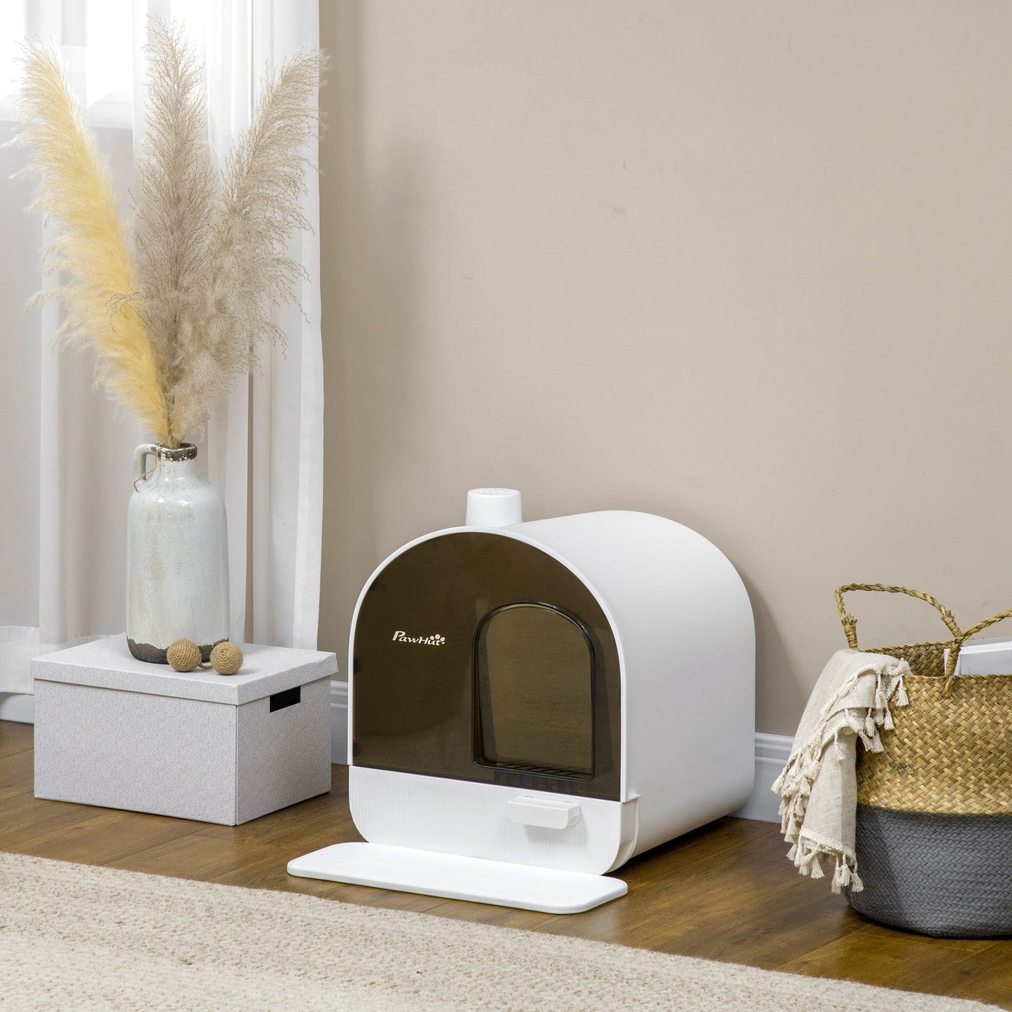 White covered cat litter box with lid featuring a transparent door in a modern living room