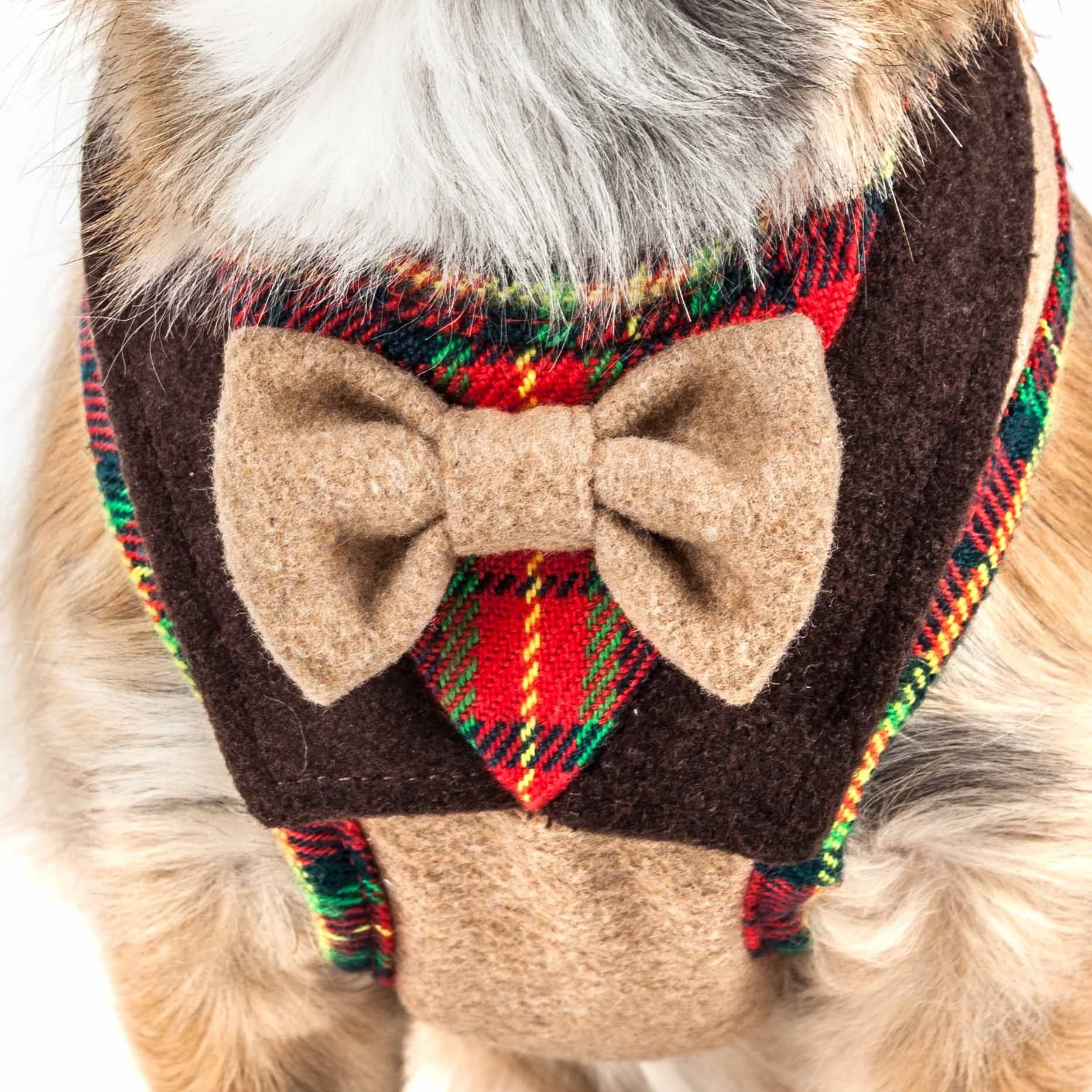 Close-up of dog wearing a brown and red plaid dog harness with bowtie from PawCounter.com