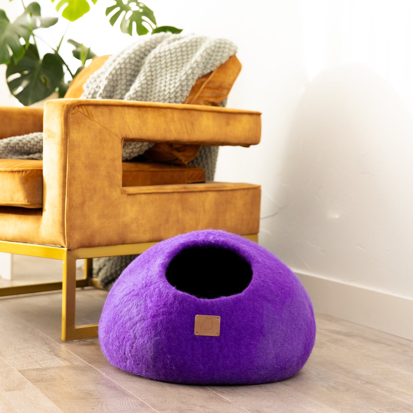 Cozy purple cat cave bed made from soft material, perfect for your feline friend to relax in
