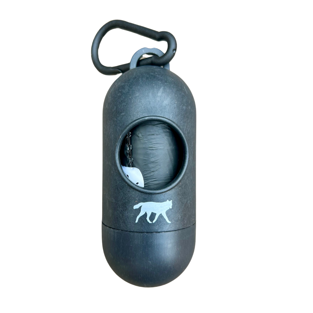 rōmng compostable dog poop bags dispenser in black with carabiner for easy attachment