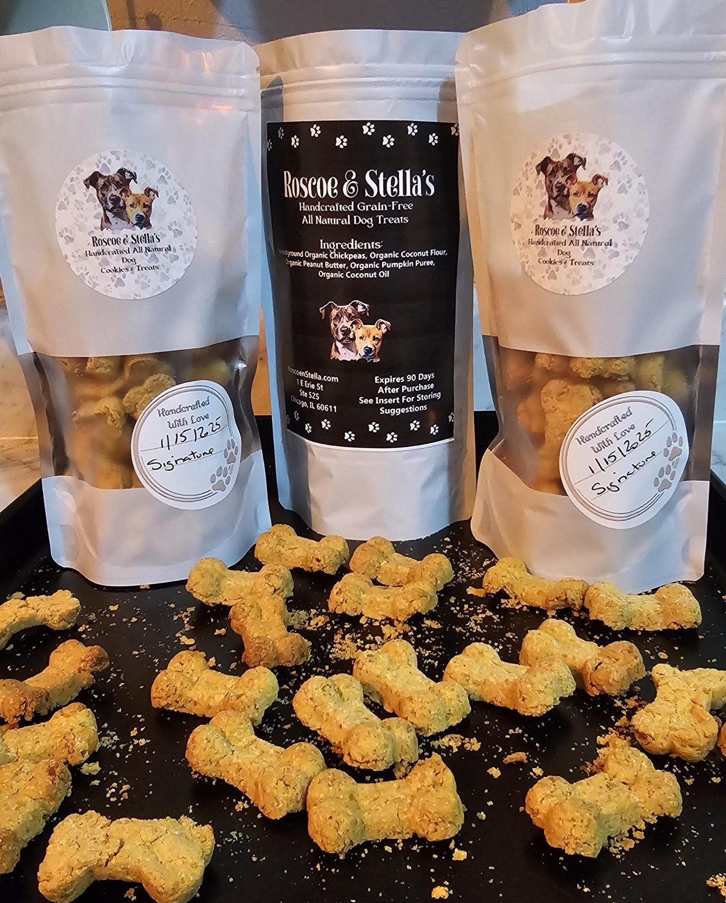 Roscoe & Stella's gourmet fruit dog treats in resealable bags with bone-shaped snacks displayed
