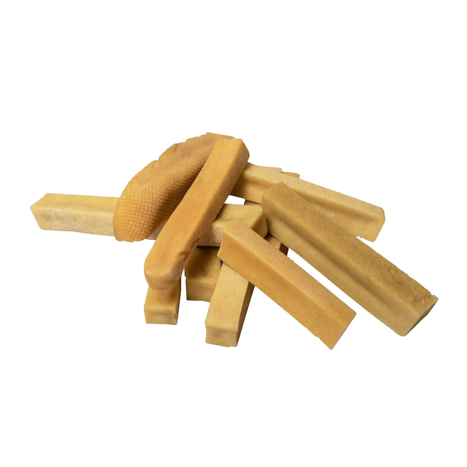 Natural himalayan yak cheese dog chew sticks piled together for dog training and chewing