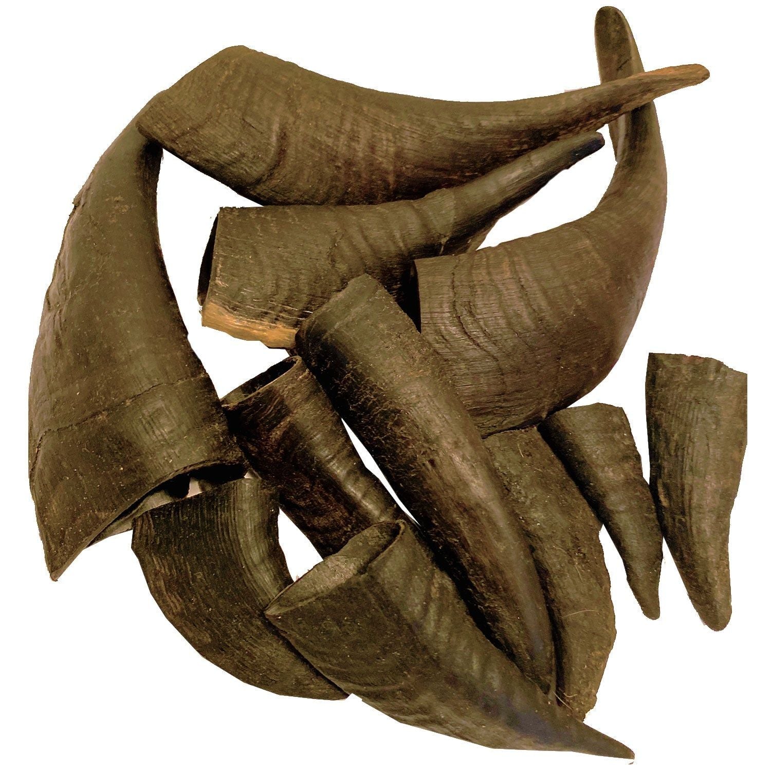 Natural goat horn dog chews pile for durable and healthy pet chewing from PawCounter.com