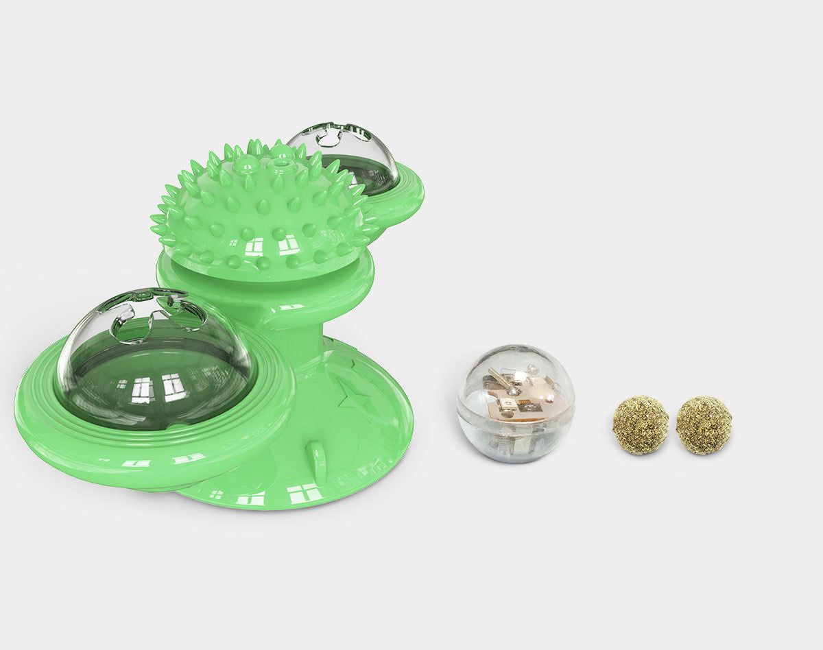 Green spinning cat toy with clear domes and textured play surfaces for interactive feline fun