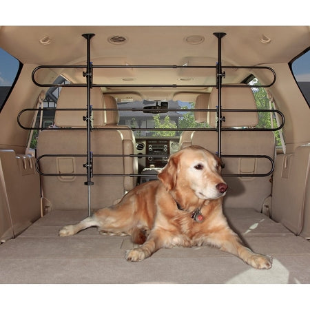 PetSafe tubular pet barrier installed in SUV trunk with golden retriever lying behind it