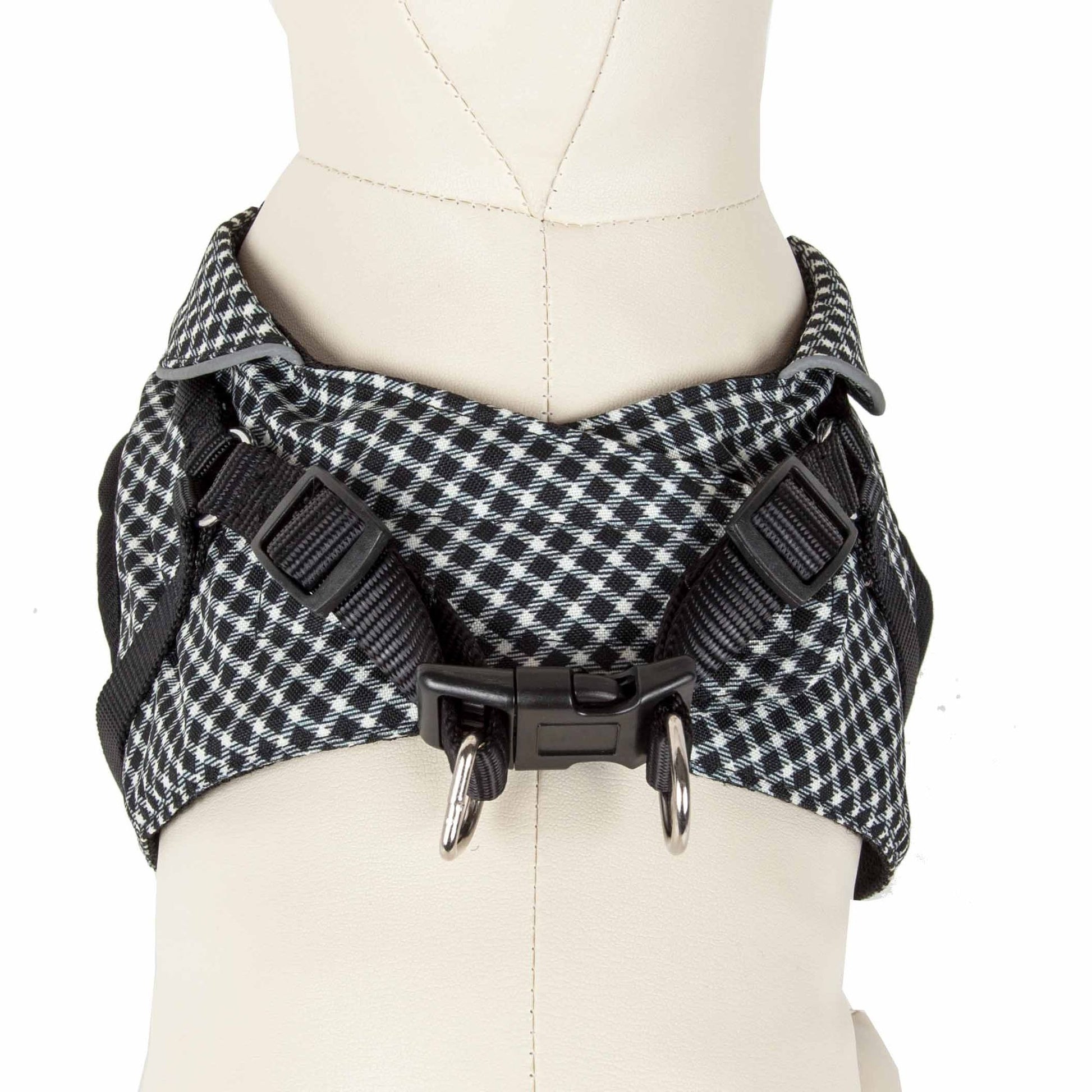 Black and white checkered adjustable dog harness with secure buckle and metal D-rings