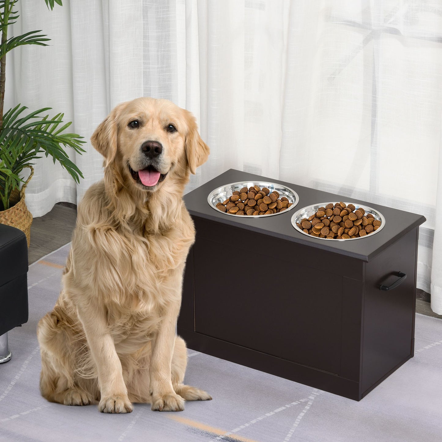 Golden retriever sitting next to a black raised dog feeding station with two stainless steel bowls filled with kibble