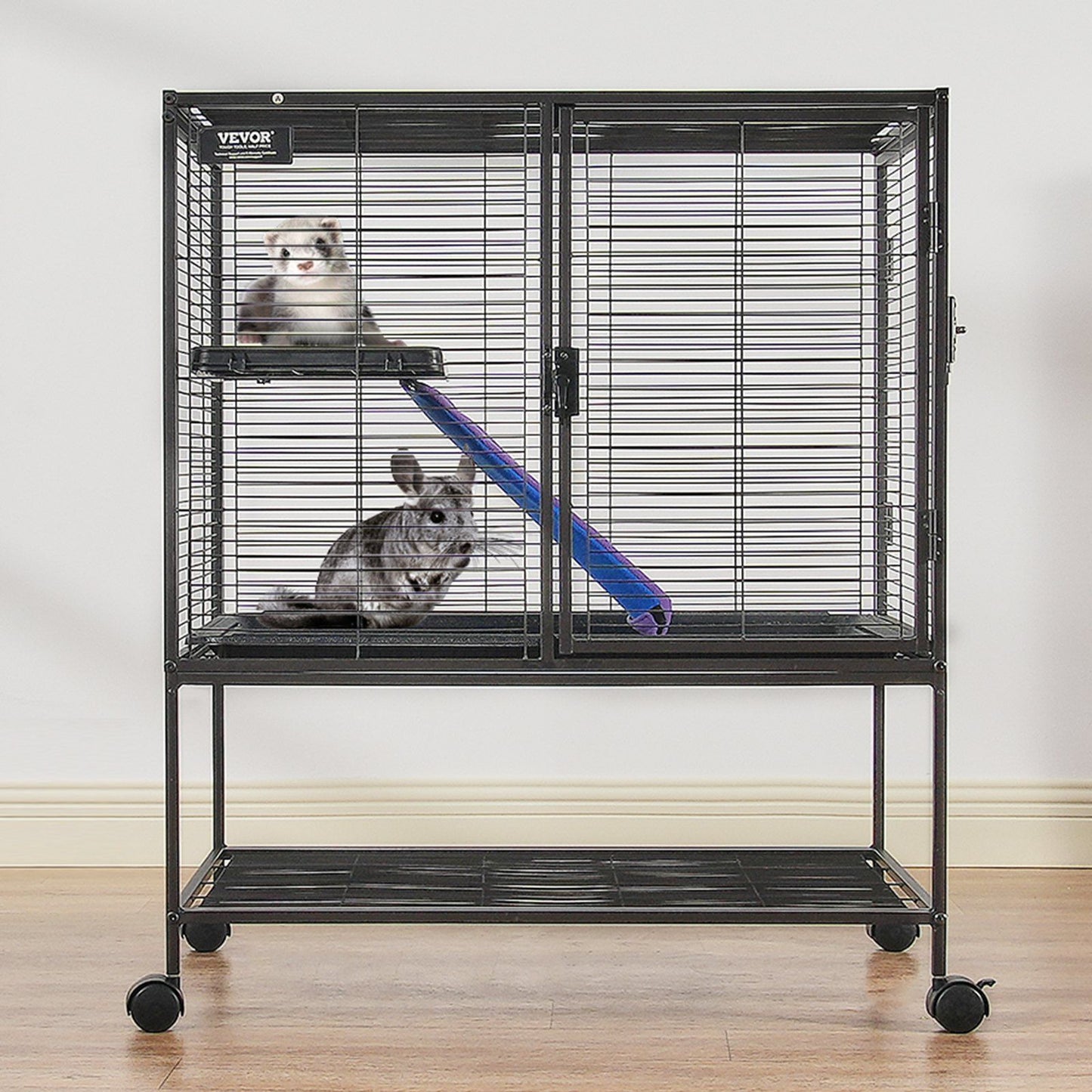 Black metal ferret cage with wheels featuring two small pets and climbing accessories inside