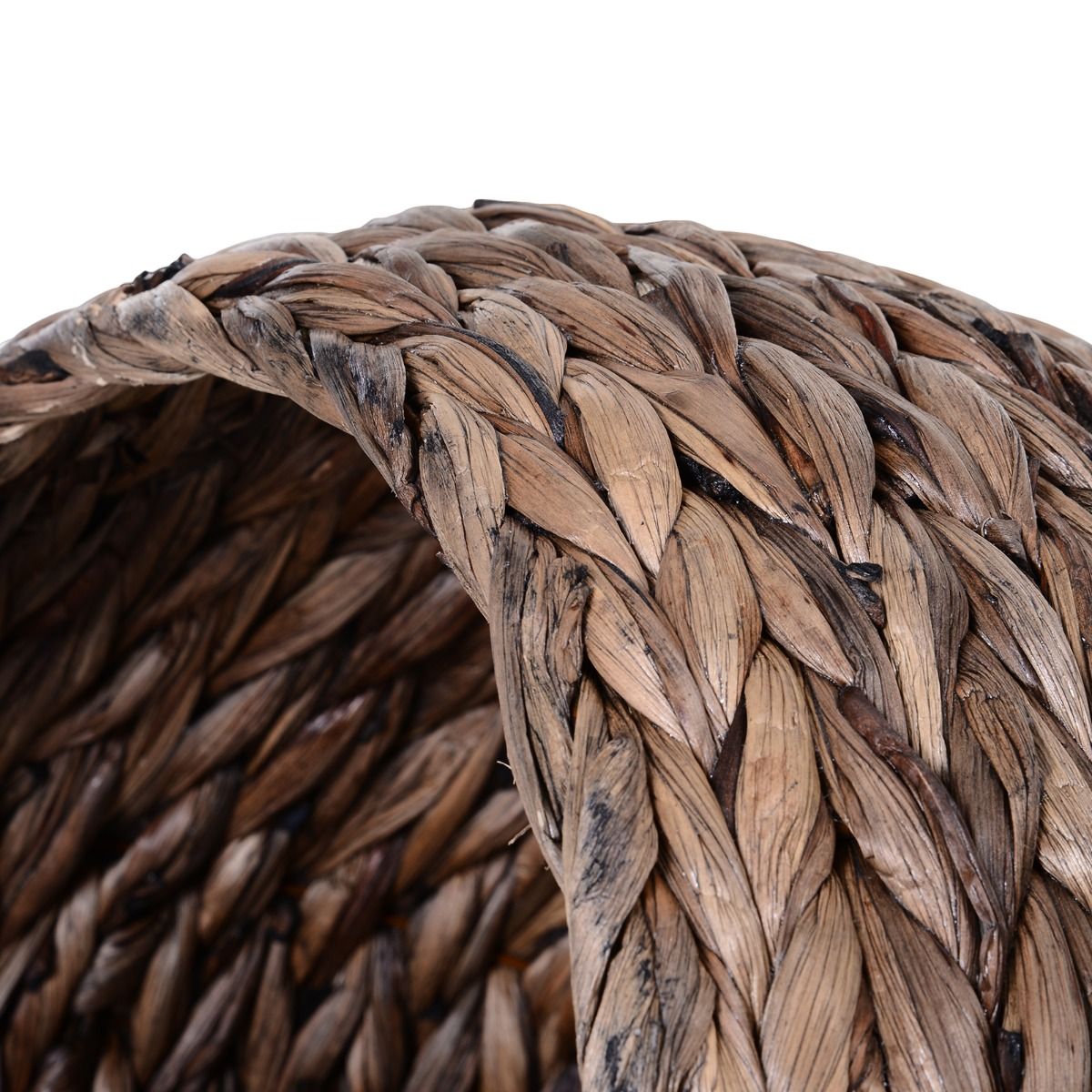 Close-up view of woven wicker cat bed with cushion showing detailed natural fiber texture