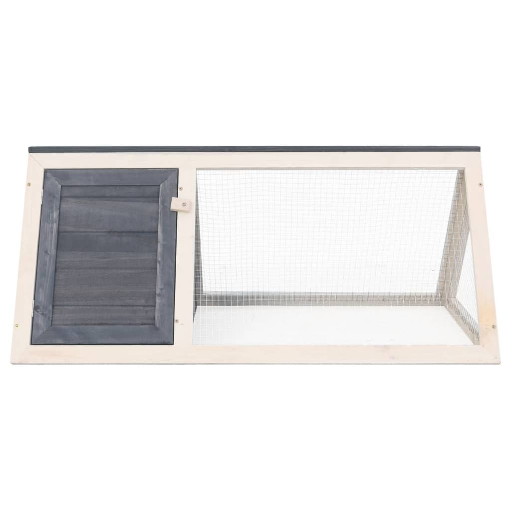 Gray wooden rabbit hutch with mesh wire enclosure and small door from PawCounter.com