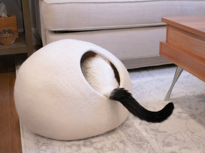 Cozy white cat cave bed providing a snug hideaway for cats to relax and play