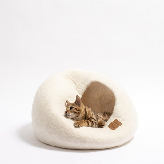 Cozy cat cave bed in white with a Bengal cat lounging comfortably inside