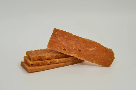 The Family Pet Chicken Dog Treats in a Stack, Perfect for Rewarding Your Furry Friend