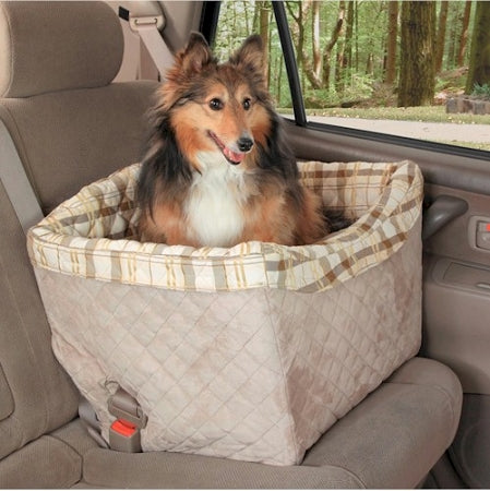 PetSafe deluxe pet booster seat in beige plaid pattern with a small dog sitting inside in a car