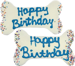 The Family Pet dog birthday bone treat with white icing and colorful sprinkles for dog celebrations