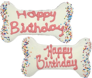The Family Pet dog birthday bone treat with white icing and colorful sprinkles for special occasions