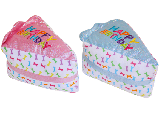 The Family Pet dog birthday cake toy in pink and blue with colorful bone patterns and Happy Birthday text