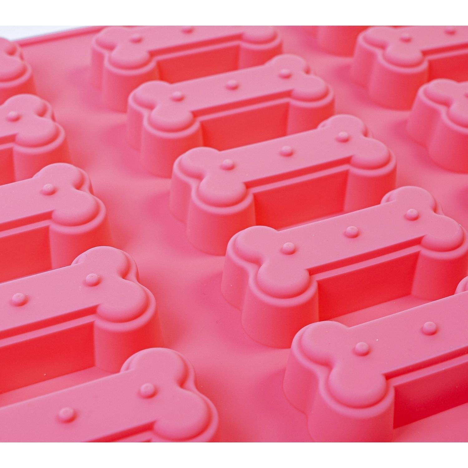 Pink dog bone silicone treat baking tray designed for making homemade pet treats