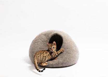 Cat resting inside earth brown pet cave by The Family Pet on white background