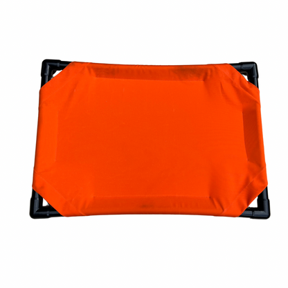 Elevated dog bed in bright orange color with sturdy frame for comfortable pet lounging