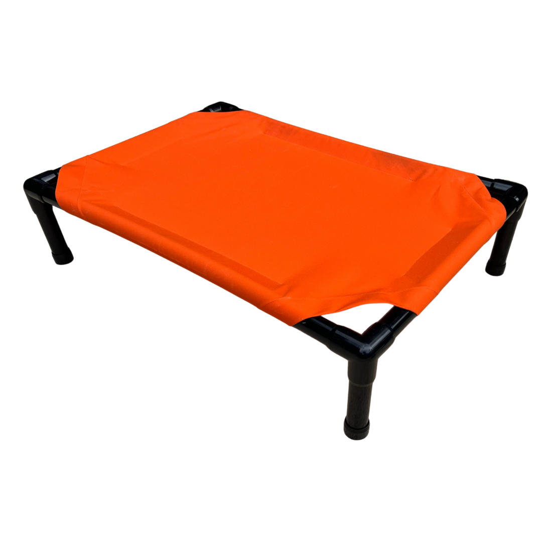 The Family Pet elevated dog bed in orange with sturdy frame for ultimate comfort and support