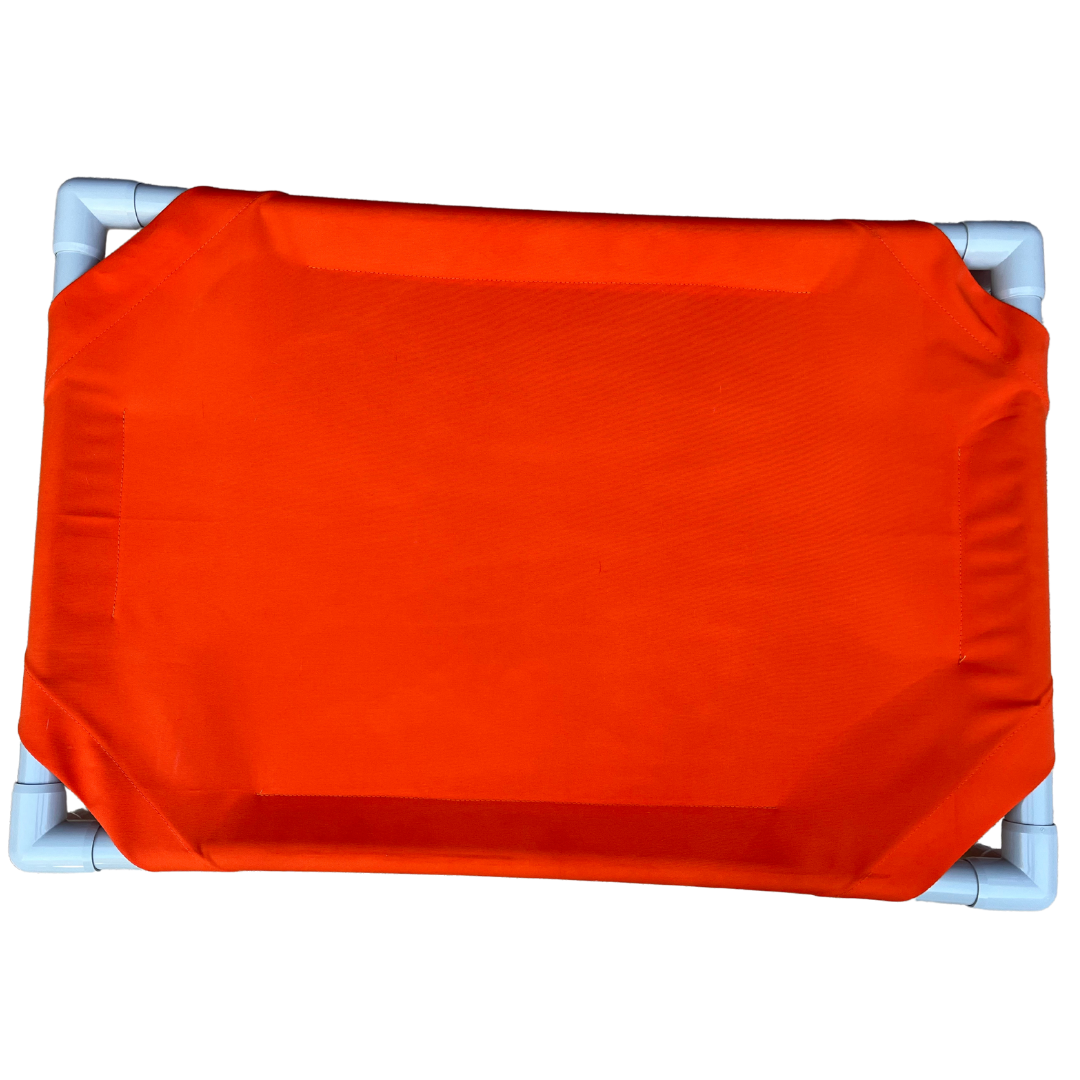 The Family Pet elevated dog bed in vibrant orange offering comfortable and breathable support for pets