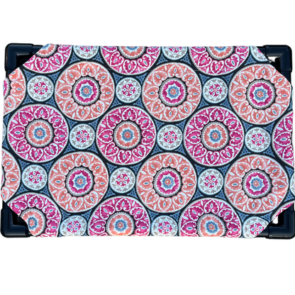 The Family Pet elevated pet bed with colorful circular patterned fabric and sturdy black frame