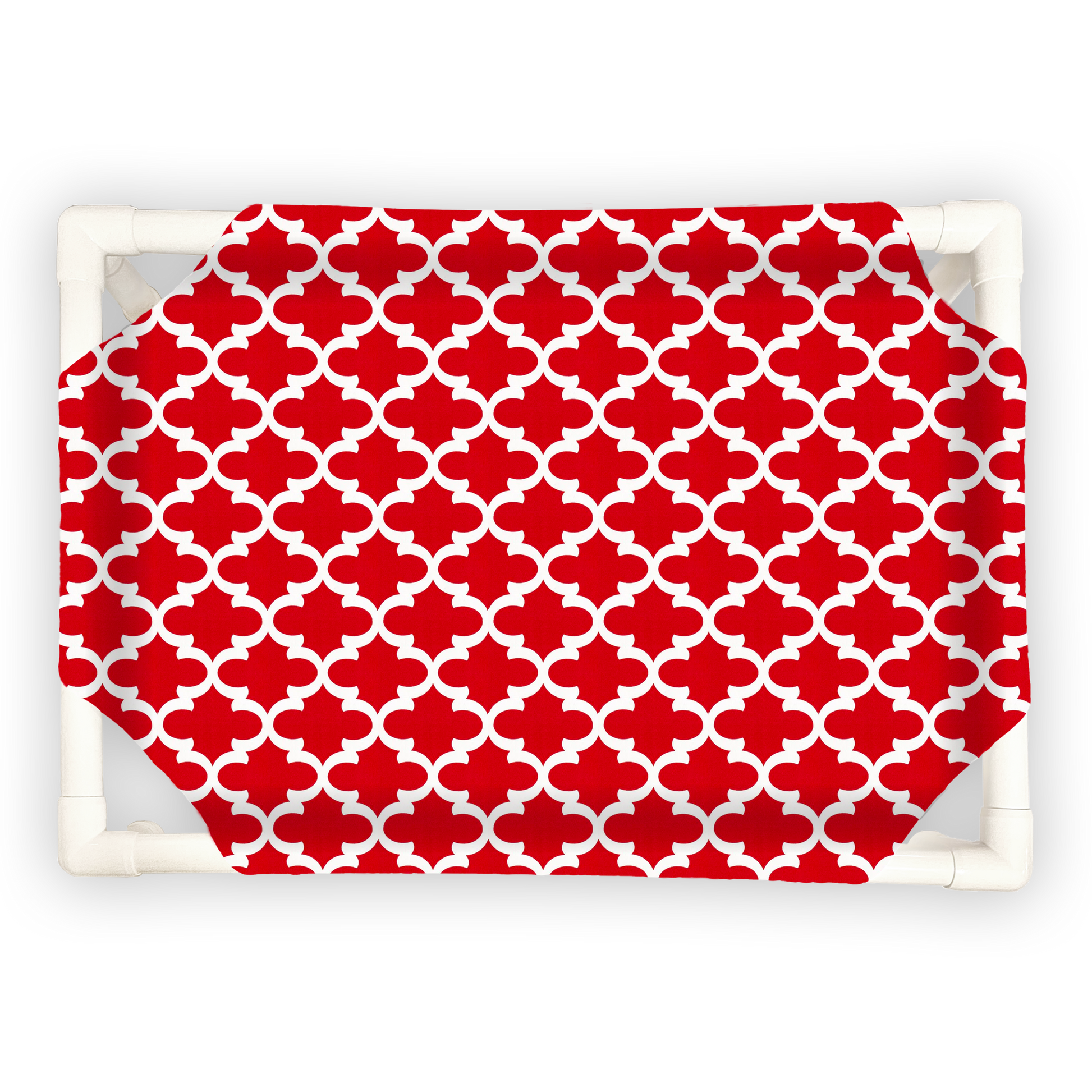 The Family Pet elevated pet bed with white frame and red patterned fabric cover