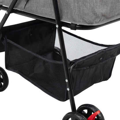 Black mesh storage basket under foldable pet stroller frame with wheels for easy transport
