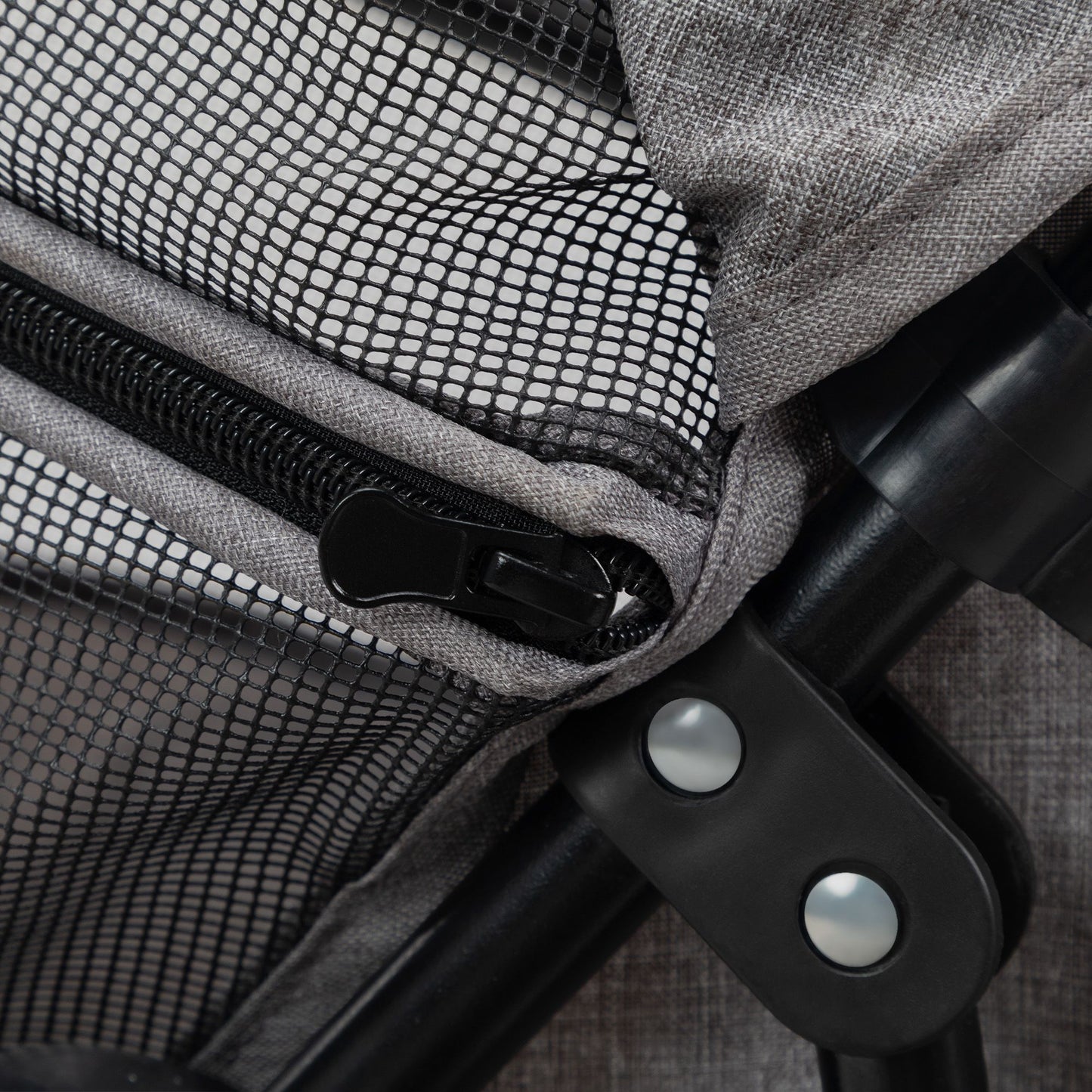 Close-up of zipper and joint on PawCounter.com foldable pet stroller with mesh and fabric materials