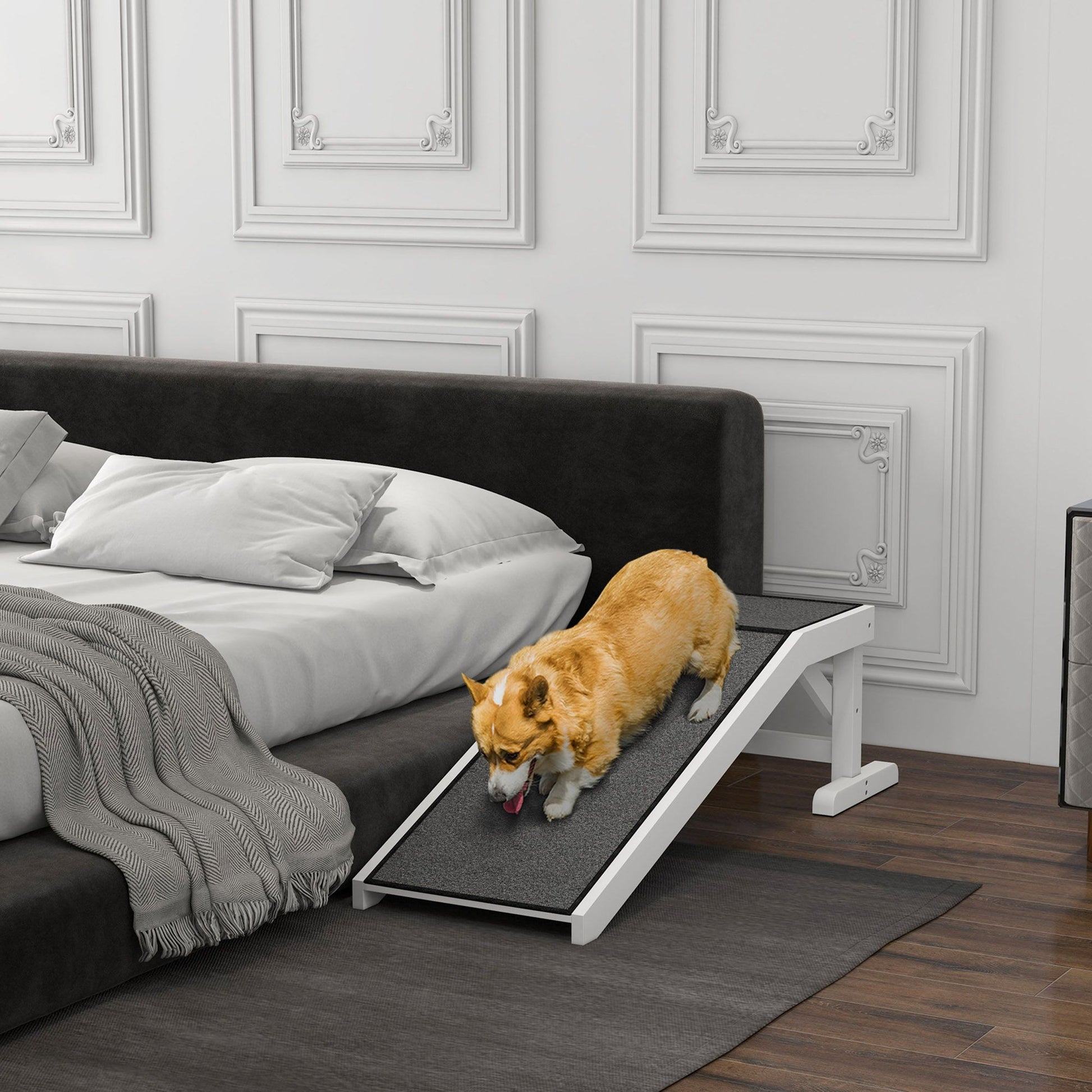 Dog ramp for bed with non-slip surface supporting a small dog climbing onto a dark upholstered bed
