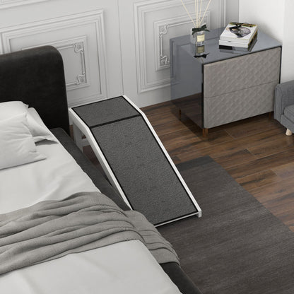 Gray and white dog ramp for bed placed beside bed with textured carpet for easy pet access