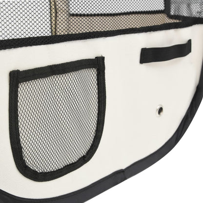 Close-up of foldable dog playpen fabric with mesh pocket and ventilation holes in white and black