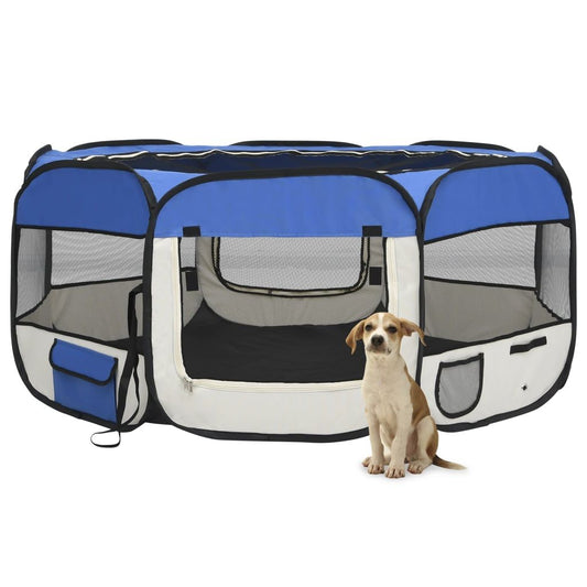 Blue and white foldable dog playpen with mesh windows and a small dog sitting beside it