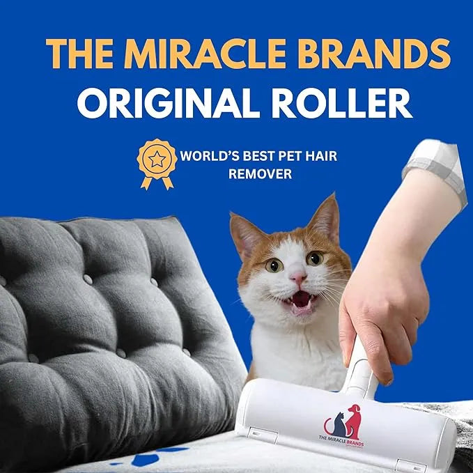 White pet hair remover roller cleaning gray tufted sofa with hand and orange white cat in background