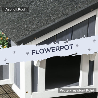 Outdoor cat house with flower pot featuring asphalt roof and water-resistant paint by PawCounter.com