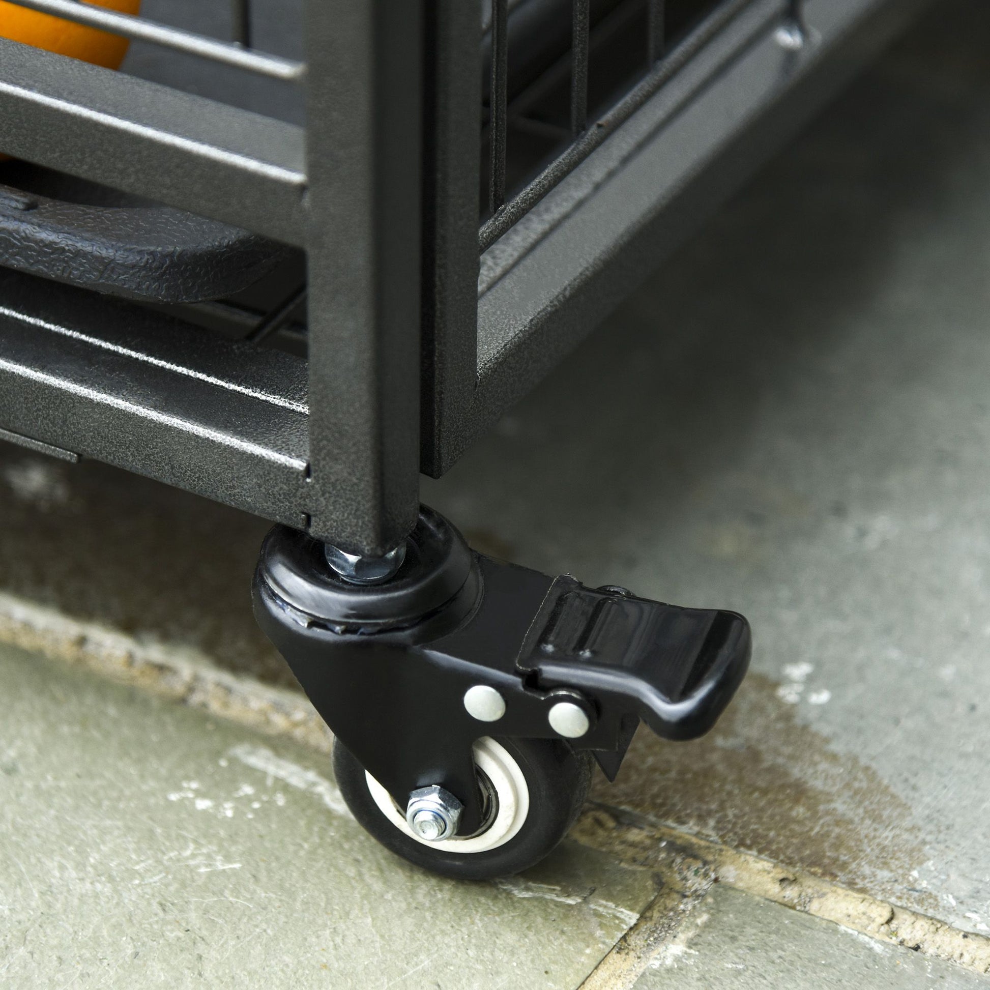 Close-up of a caster wheel on a heavy duty dog crate with wheels for easy mobility
