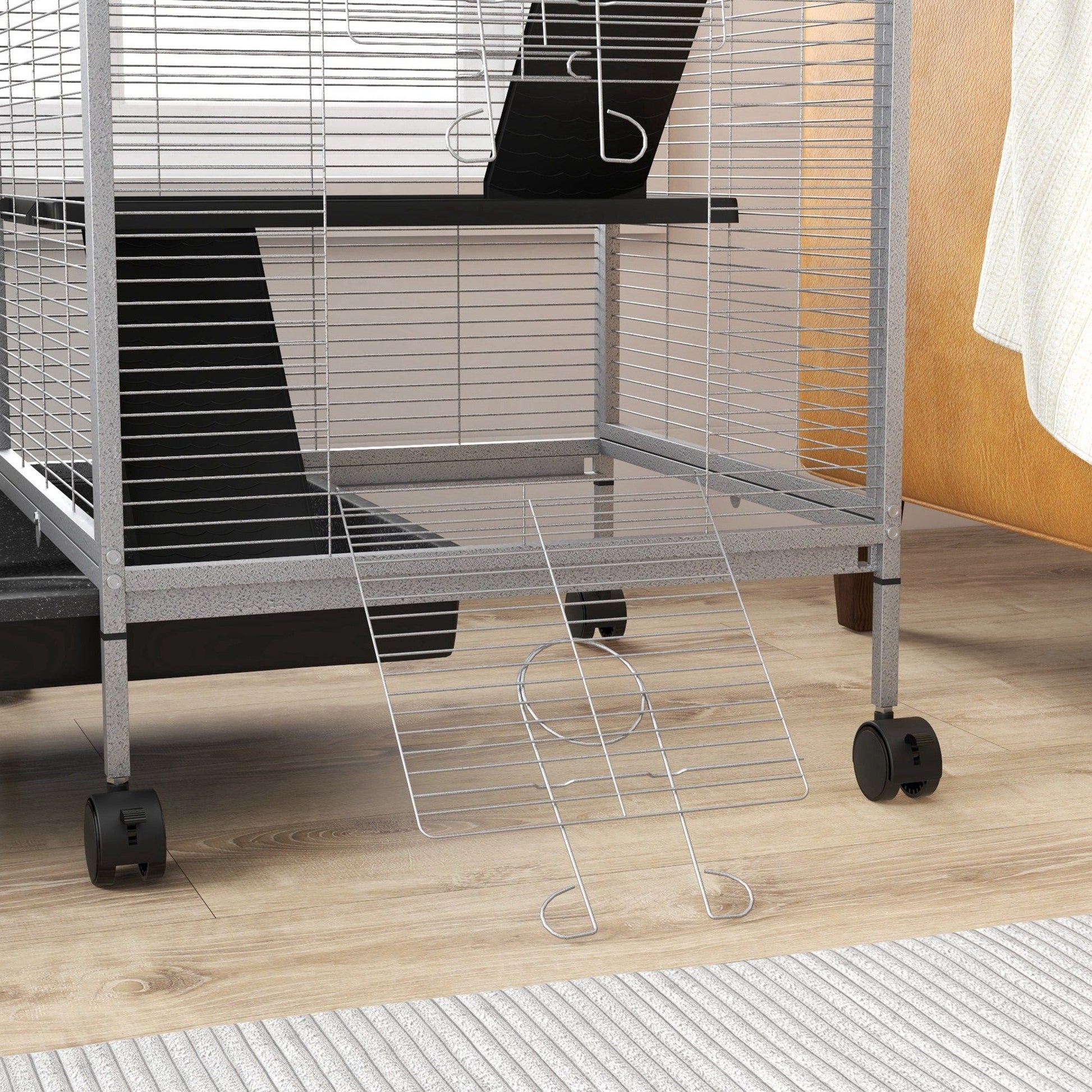 Large ferret cage with wheels showing metal wire frame and ramp on wooden floor