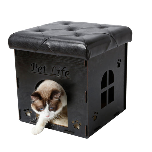 Black collapsible cat house furniture with cushioned top and cat entering opening