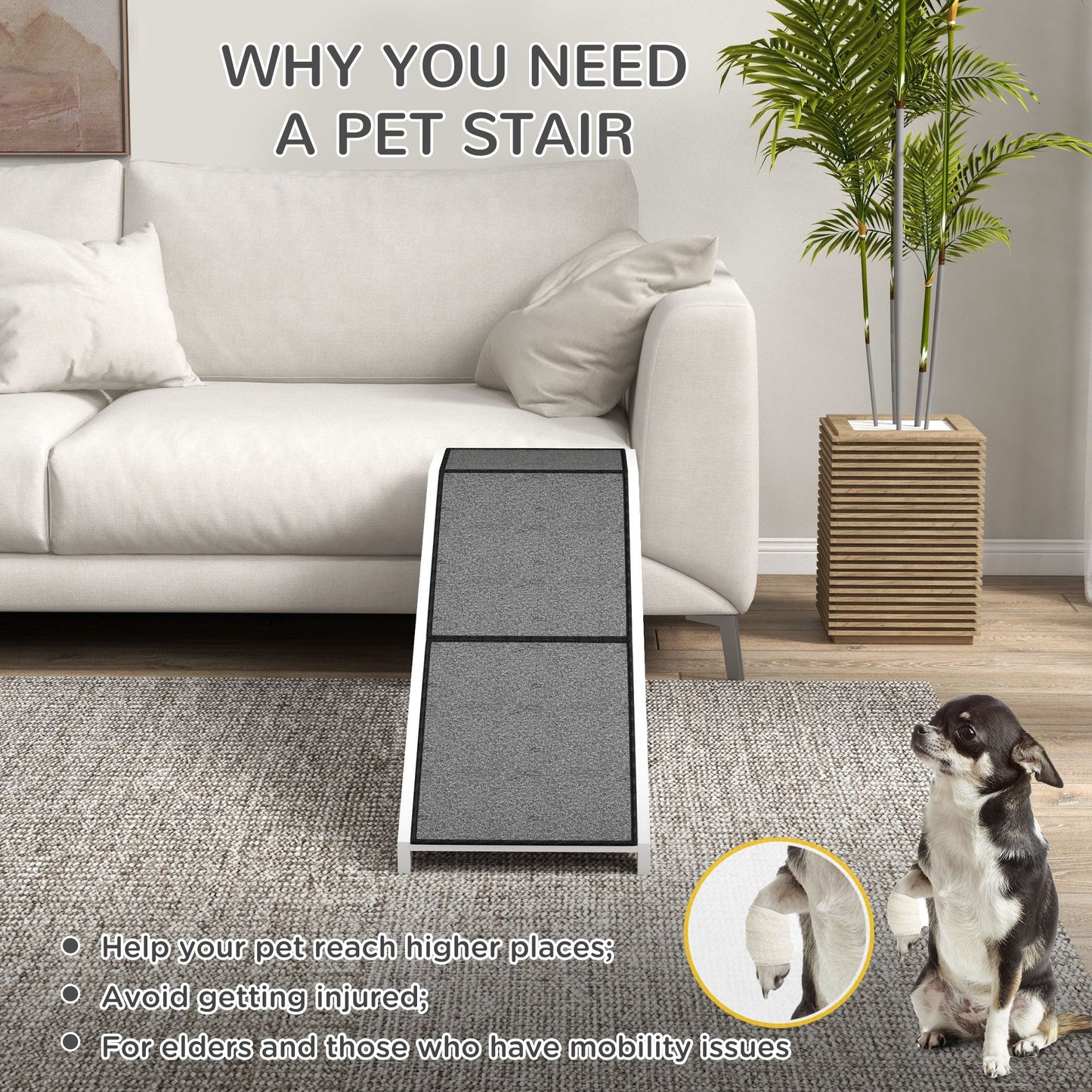 Grey pet ramp for dogs and cats placed in front of white sofa with dog sitting nearby
