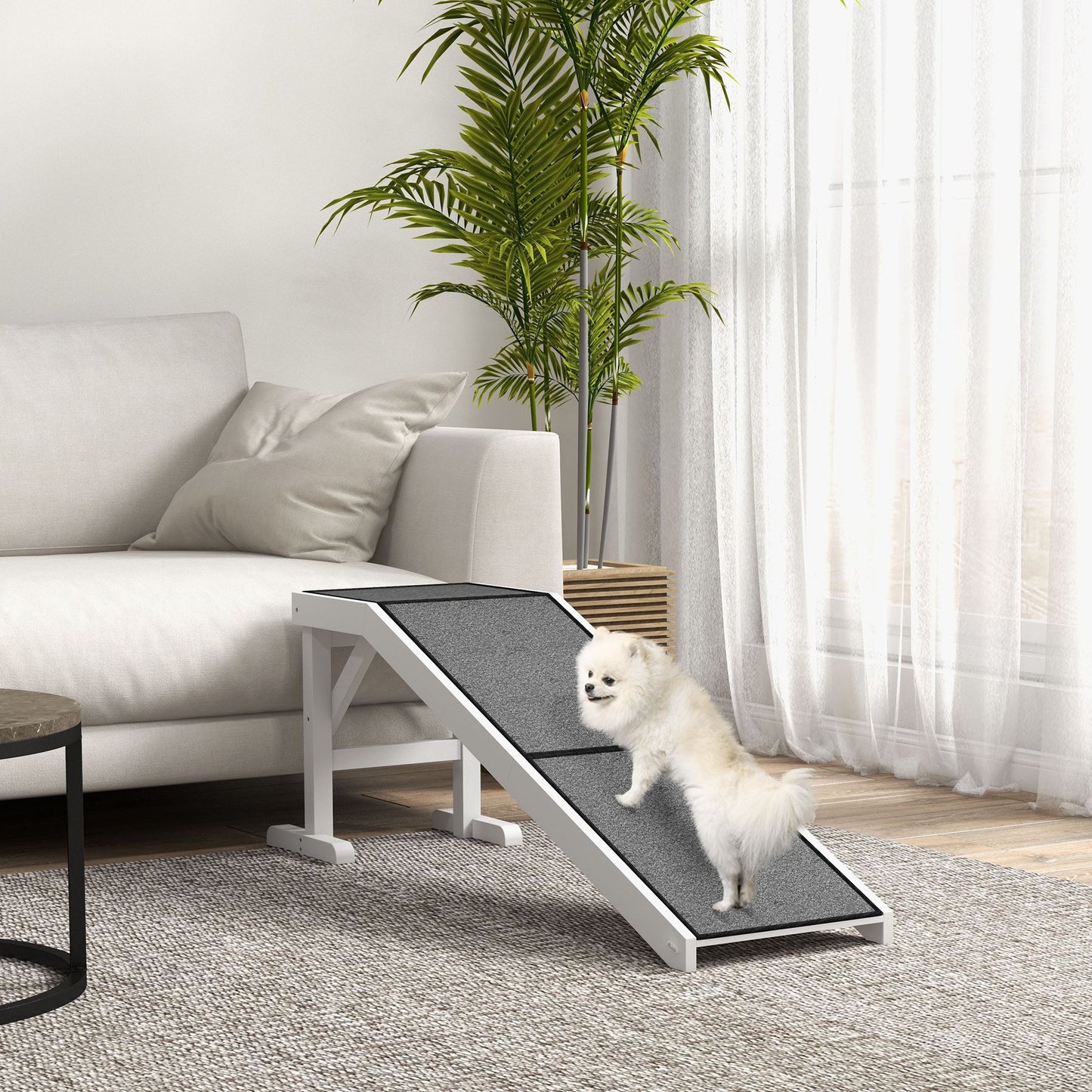 Pet ramp for dogs and cats with non-slip surface and sturdy white frame in modern living room