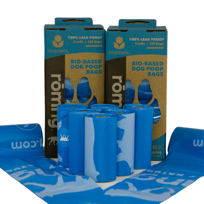 rōmng bio-based dog poop bags in blue packaging with six rolls of 120 bags for eco-friendly cleanup