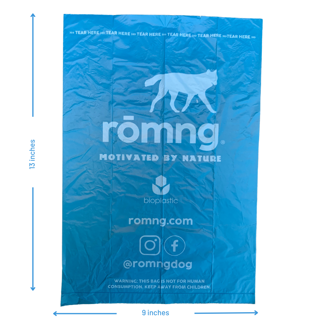 Blue rōmng bio-based dog poop bags with tear marks for eco-friendly waste disposal